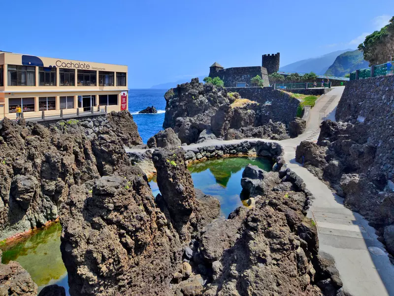 A restaurant overlooking rocky headland and natural pools. 