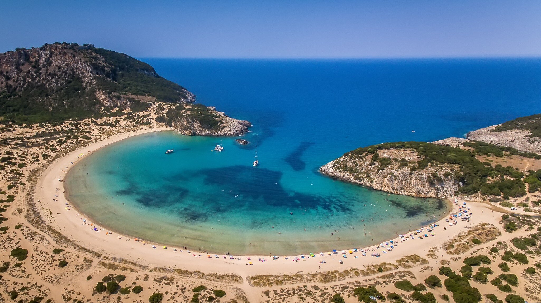 Panoramic aerial view of voidokilia beach, one of the best beaches in mediterranean Europe, beautiful lagoon of Voidokilia from a high point of view, Messinia, Greece; Shutterstock ID 1007122711;