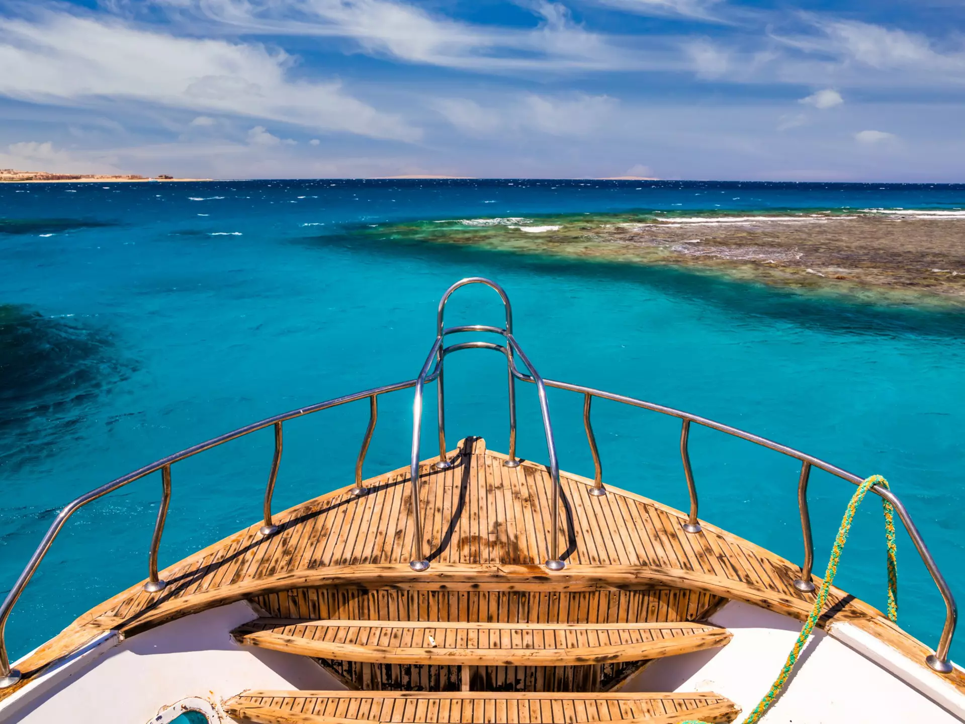 Cruise boat in the clear water near coral reef.
1273438607