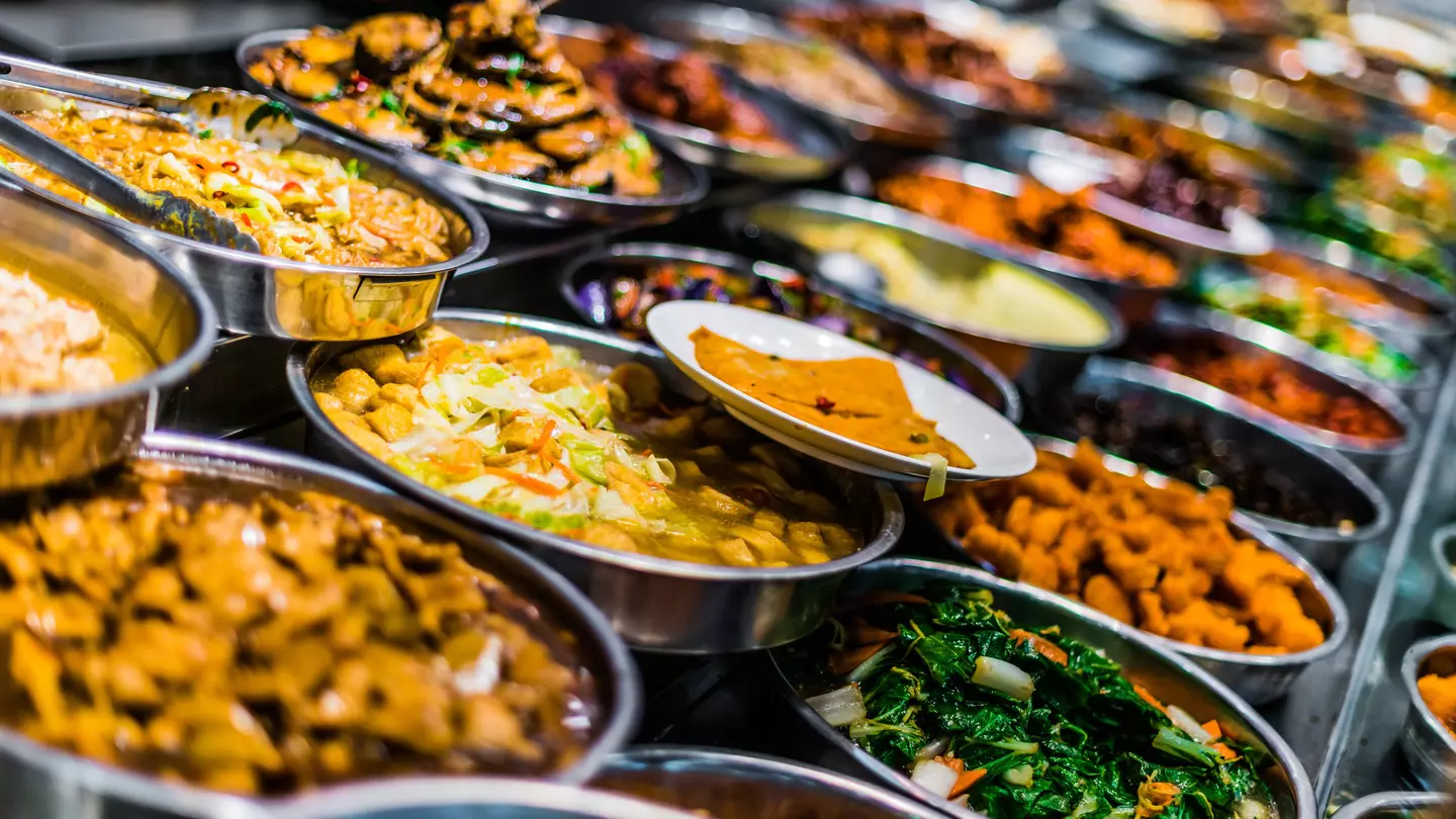 A colourful child-sized kitchen with an interactive screen to teach visitors how to make classic french dishes.