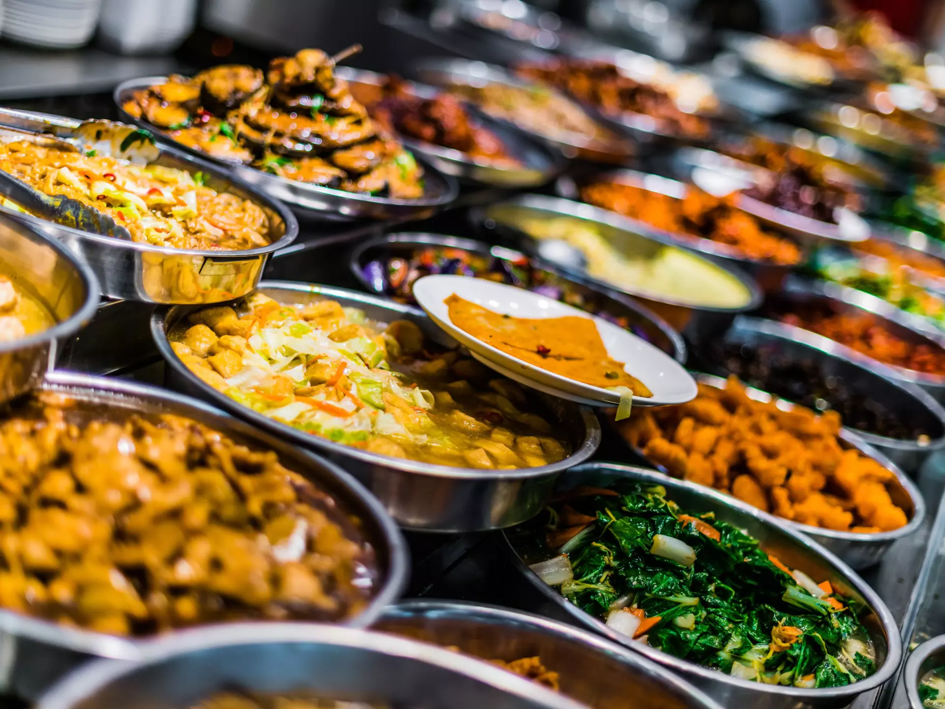 A colourful child-sized kitchen with an interactive screen to teach visitors how to make classic french dishes.