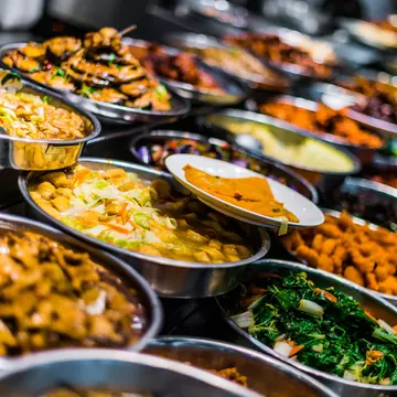 A colourful child-sized kitchen with an interactive screen to teach visitors how to make classic french dishes.
