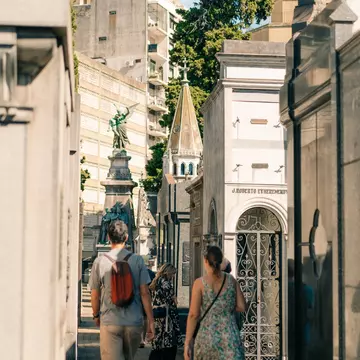 People walking through Recoleta Cemetery, the most famous cemetery in Buenos Aires, Argentina.