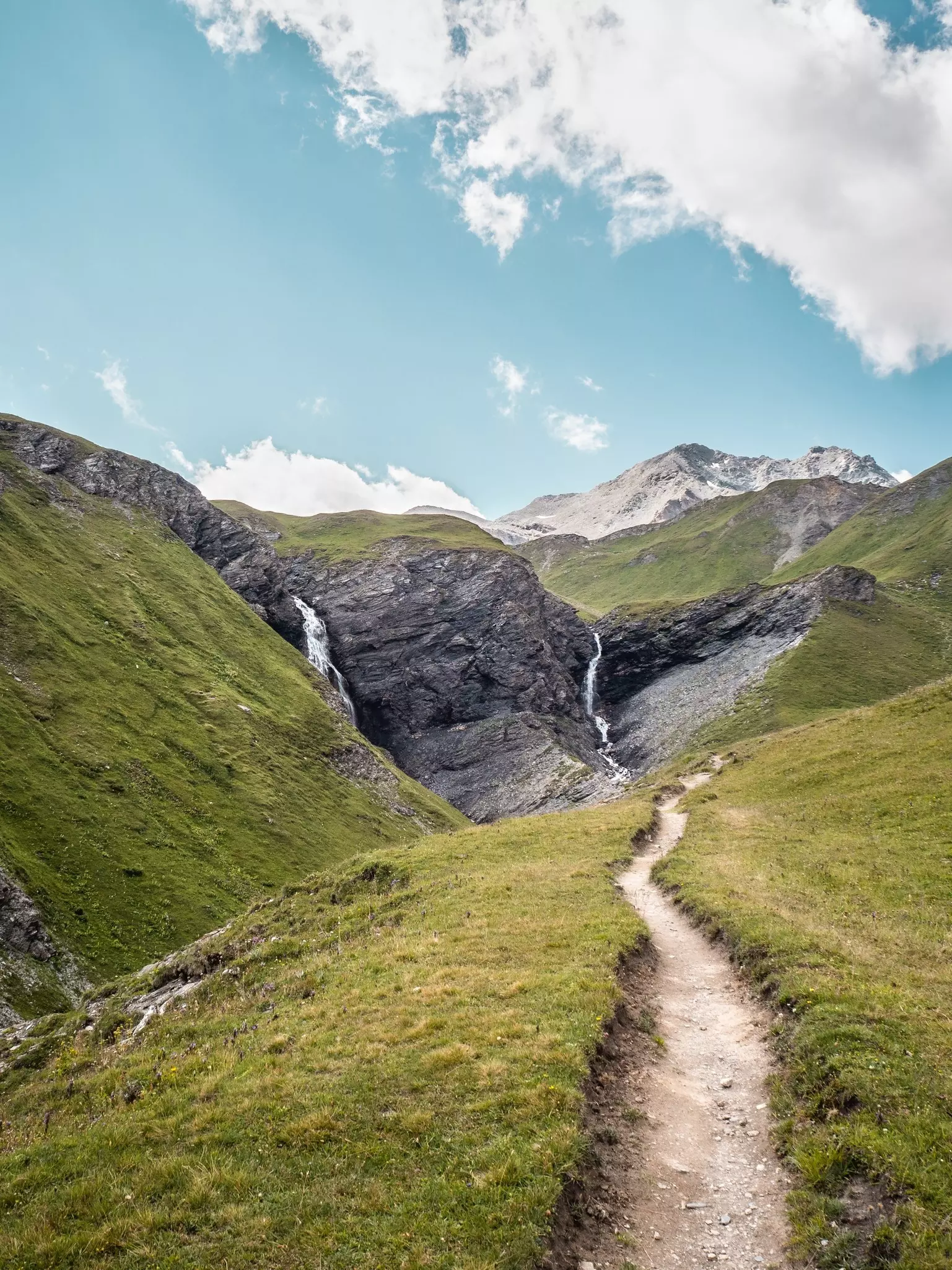 A tranquil landscape of a hiking path on a mountain near Val-d'Isere and Tignes