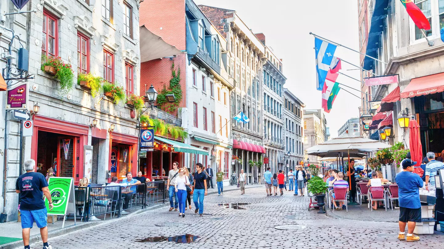 Pedestrians walking at the junction of Rue Saint-Paul and Rue Saint-Vincent in Old Montreal