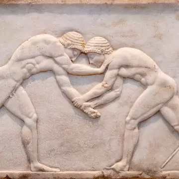 Ancient bas-relief on grave stele in Kerameikos with scene from Palaestra - wrestlers in action. On the left an athlete is ready to jump, on the right another one prepairing the pit. Athens, Greece; Shutterstock ID 1745203673; your: Erin Lenczycki...
