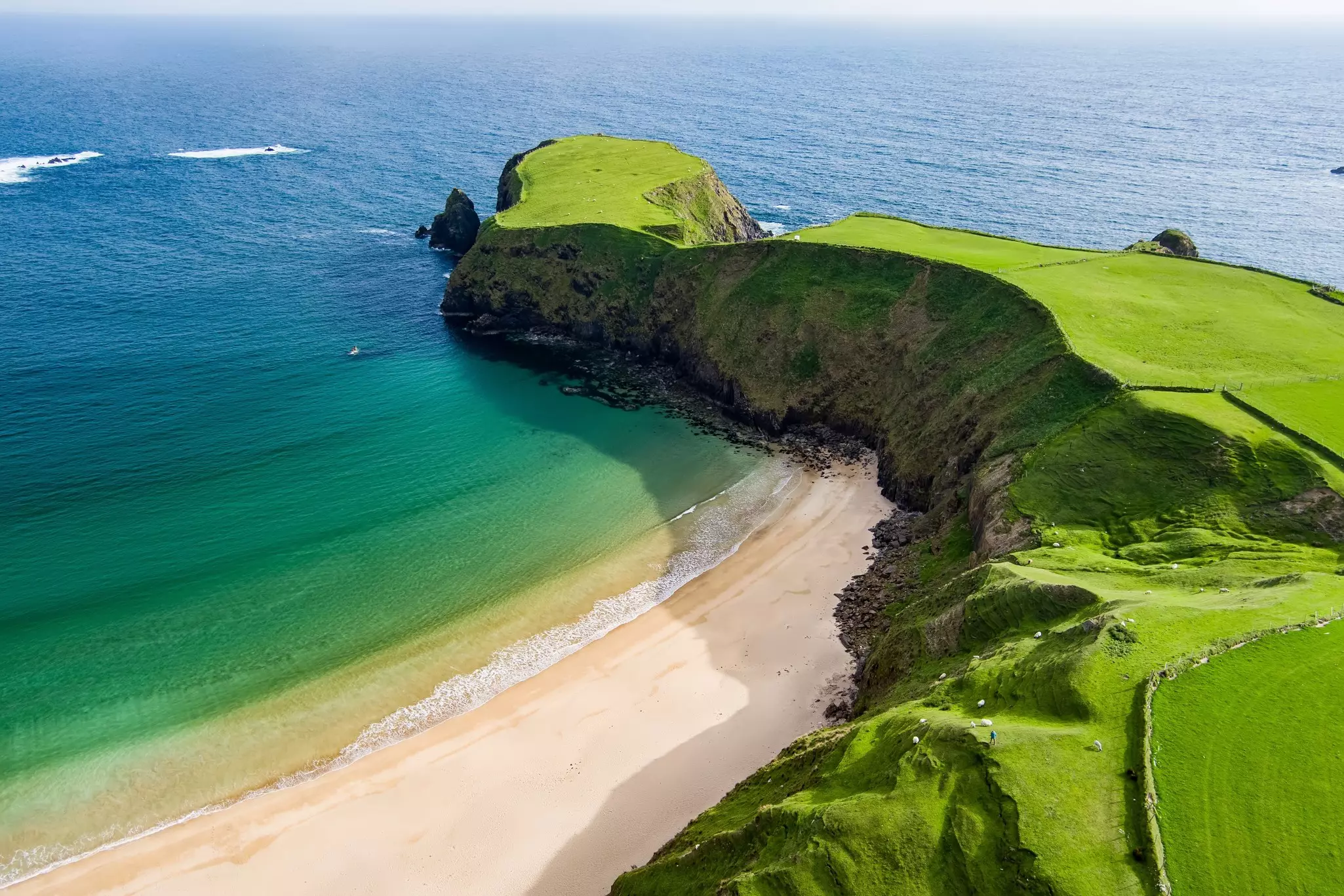 Silver Strand, a sandy beach in a sheltered, horseshoe-shaped bay, is situated at Malinbeg in Donegal. 