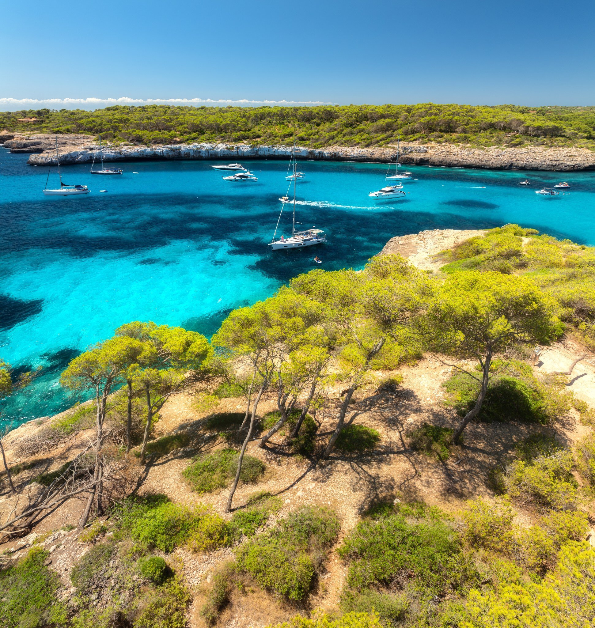 View of boats in the water by Cala Mondragó on the island of Mallorca, Spain.