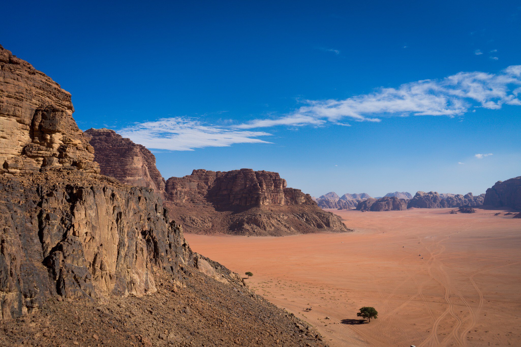 View from Jebel Rum in wadi rum desert, camp from view, Rock mountains in Jordan, lonely tree in the desert; Shutterstock ID 1612550701;