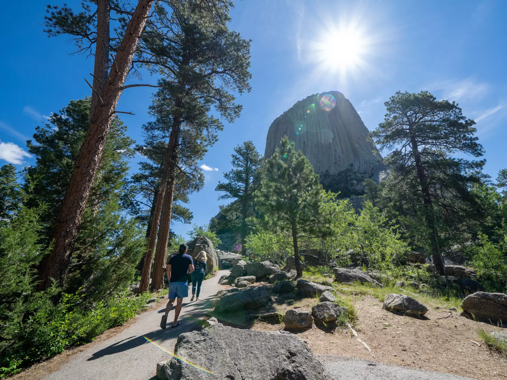 Hikers walk towards Devils Tower National Monument in Wyoming
1813755026
america, attraction, devils tower, devils tower wyoming, erosion, family vacation, formation, geological, geology, indians, lakota, landmark, landscape, monolith, monument, mountain, national monument, national monuments, native american, natural, nature, outdoors, park, pillar, rock, sacred site, scenic, selfies, summer, sunflare, taking photos, tourism, tourists, travel, united states, vacation, volcanic, volcano, western, wilderness, wyoming