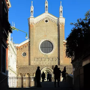 Silhouettes in front of the Basilica dei Santi Giovanni e Paolo, known in Venetian as San Zanipolo, a church in Venice, Italy.