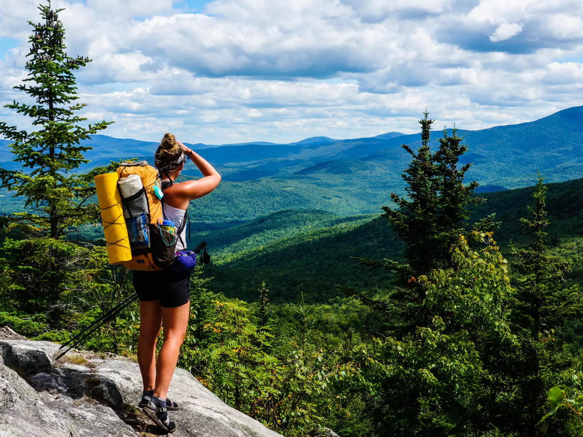 AUGUST 2015: An Appalachian Trail Thru-Hiker looks back at New Hampshire just before she crosses into Maine.
461054086
backpack, adventure, hiker, backpacker, view, mountains, trees, trek, forest, ridge, maine, journey, august, thru-hike, trail, appalachian, new, hampshire