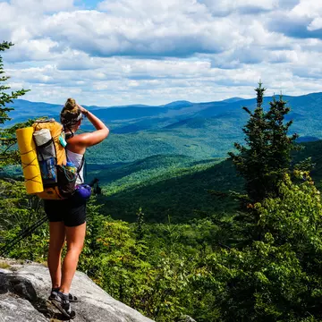 AUGUST 2015: An Appalachian Trail Thru-Hiker looks back at New Hampshire just before she crosses into Maine.
461054086
backpack, adventure, hiker, backpacker, view, mountains, trees, trek, forest, ridge, maine, journey, august, thru-hike, trail, appalachian, new, hampshire