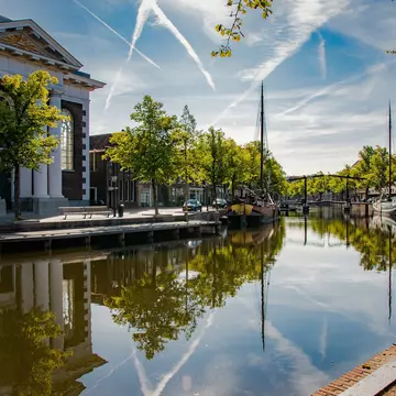 Schiedam's picturesque canals are merely an accompaniment to its main draw: gin. miranda leenheer / Shutterstock
