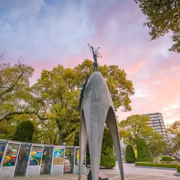 MARCH 24, 2019: The Children's Peace Monument with a statue of a girl holding a folded paper crane, at the Hiroshima Peace Memorial Park.
1385919353
architecture, asia, asian, atomic, attraction, bomb, building, children, childrens, city, cityscape, culture, destination, exterior, famous, garden, girl, heritage, hiroshima, historic, historical, history, japan, japanese, landmark, little, memorial, monument, nature, outdoor, paper, park, peace, place, religion, sadako, sasaki, site, structure, tourism, travel, unesco, victims, war, world