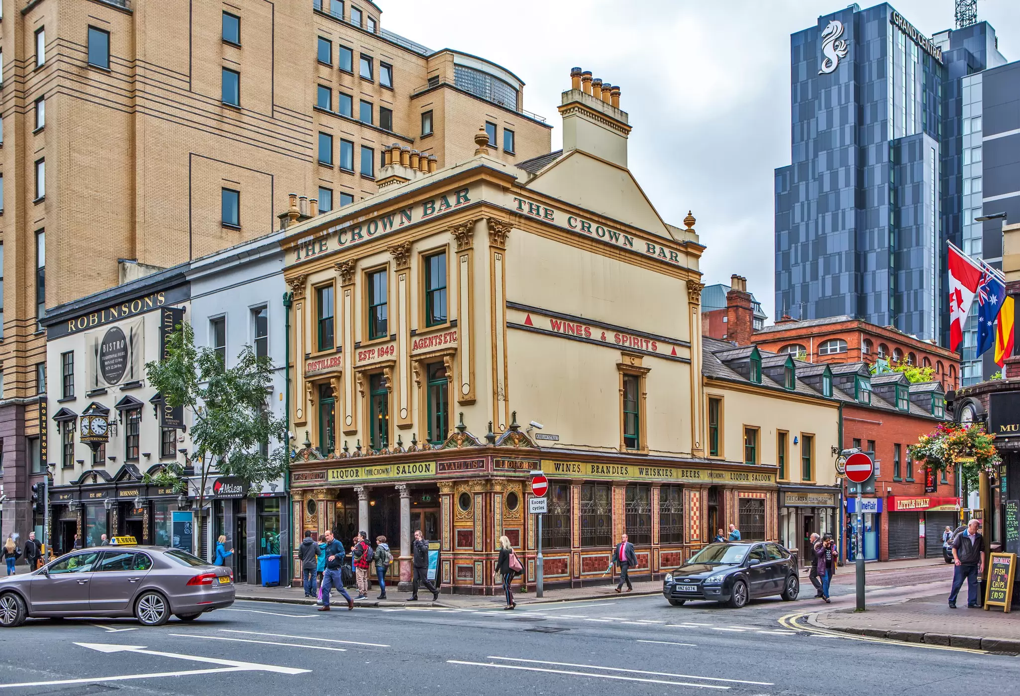 People walking past the Crown Liquor Saloon in Belfast