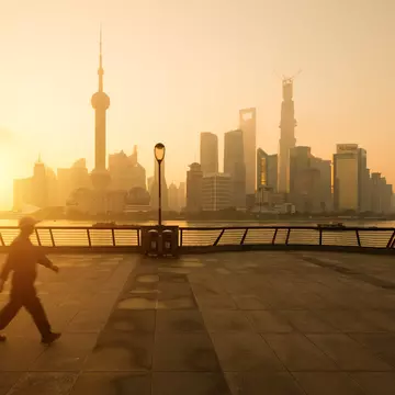 A stroll along the Bund at sunrise offers a great view across the Huangpu River to the skyscrapers of Shanghai's Pudong district. Spreephoto.De / Getty Images