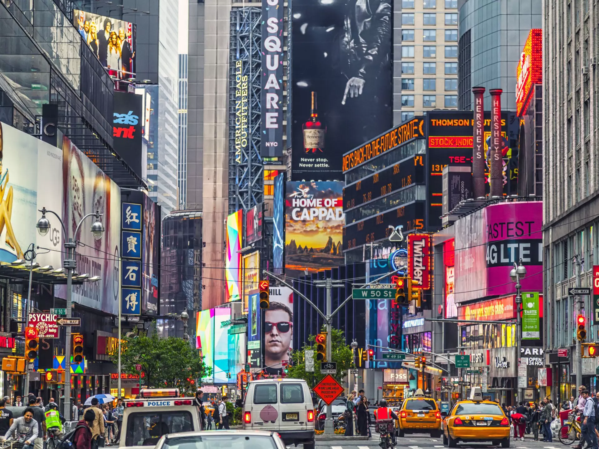 Times square billboards and traffic during the day.
499872775
Street Light, Times Square, Travel Destinations, Horizontal, City, City Street, Broadway - Manhattan, Advertisement, New York City, Manhattan - New York City, New York State, Zebra Crossing, Broadway, Lens Flare, Downtown District, Sign, Lighting Equipment, Photography, City Life, Billboard, Crowd, Nightlife, Street, People, USA, Town Square, Skyscraper, Digital Signage, Building Exterior, Taxi, Commercial Sign, International Landmark, Day, Tourist, Outdoors, Manhattan, Built Structure, Times Square - Manhattan, Tourism
