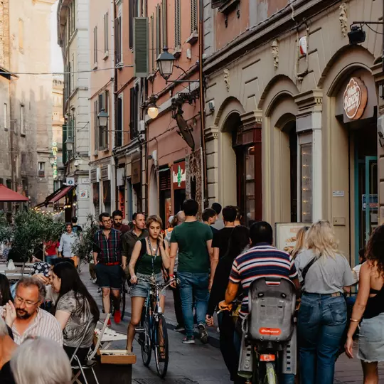 Bologna - Italien. 18. May 2022: View of Tourists and Locals dining and walking in the Heart of Bologna's old city