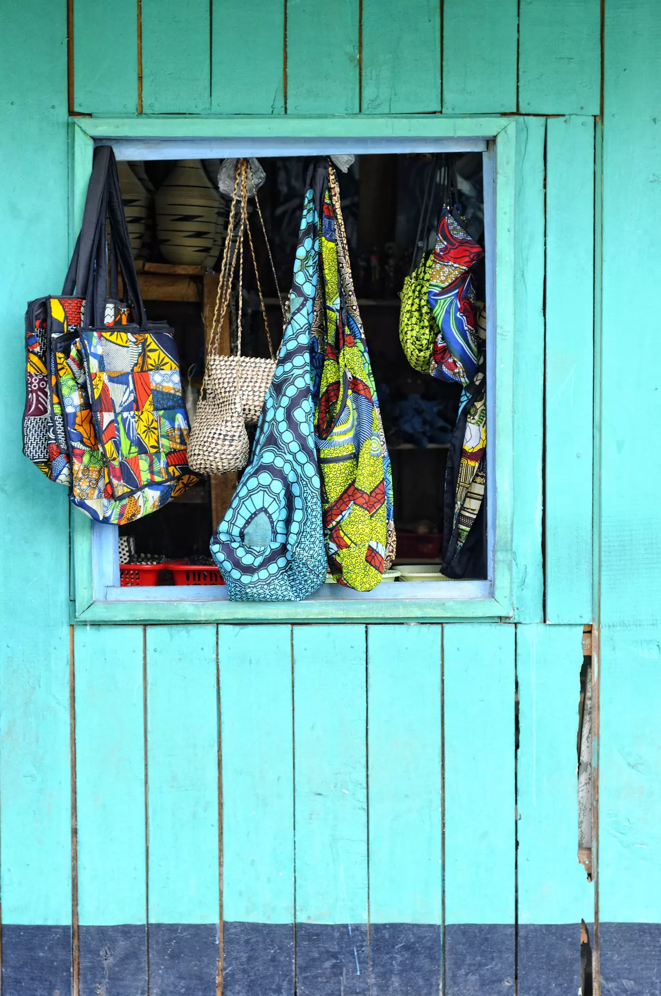 Ethnic fabrics and woven goods are displayed in a Kigali shopfront in Rwanda © Jaco Wolmarans / Getty Images