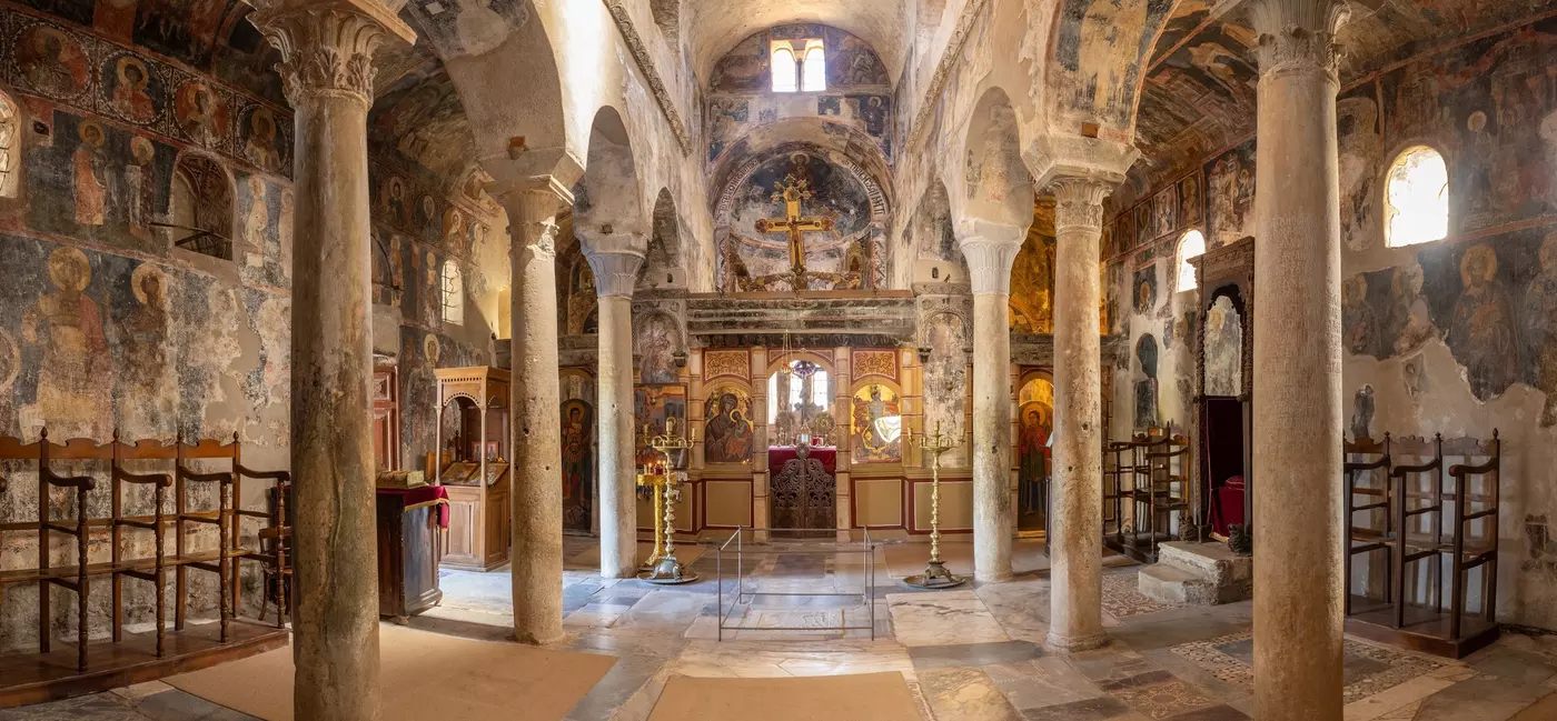 Interior of a Greek church with beautifully painted frescoes.