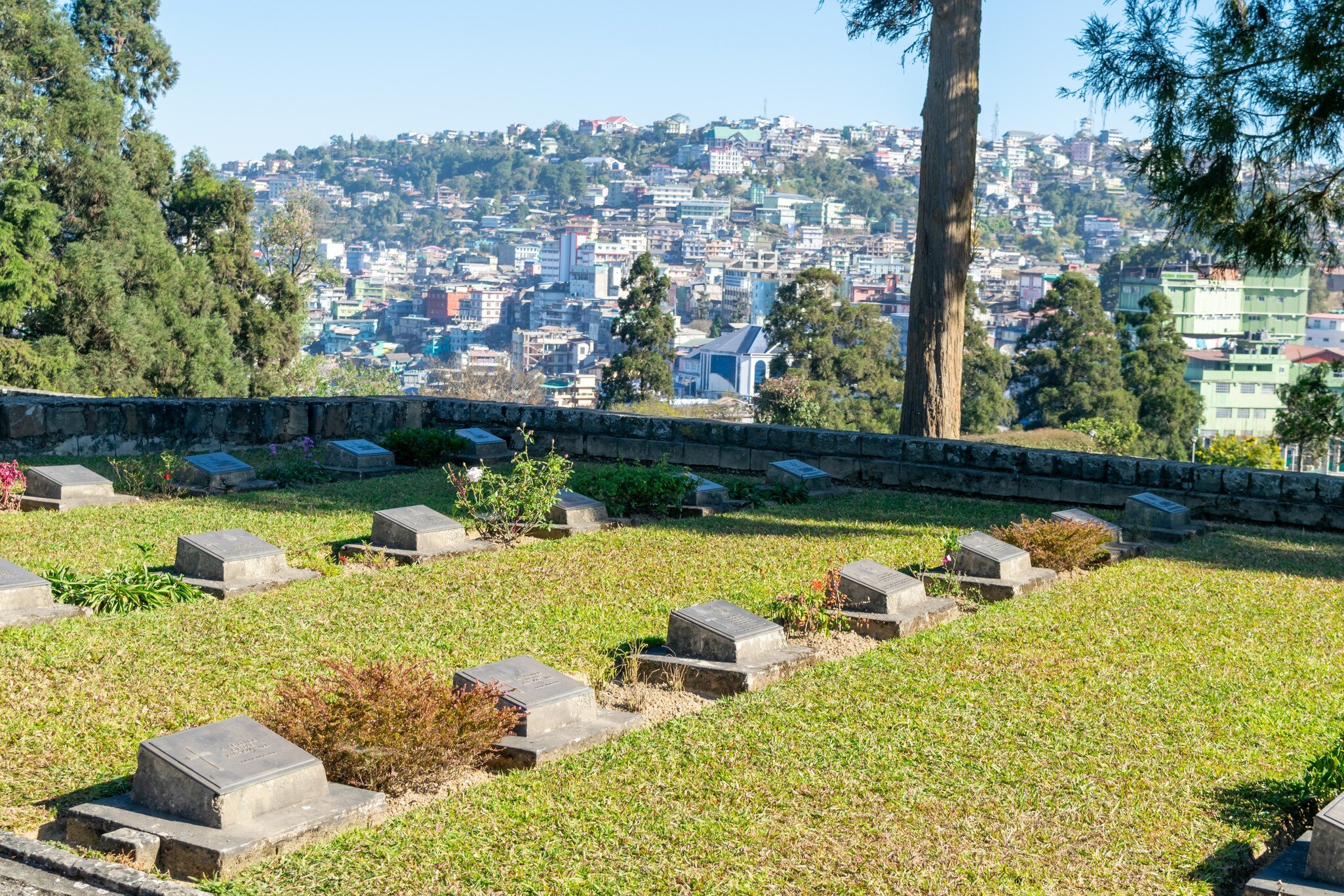 View of Kohima War Cemetery with city in the background. Nagaland, India.