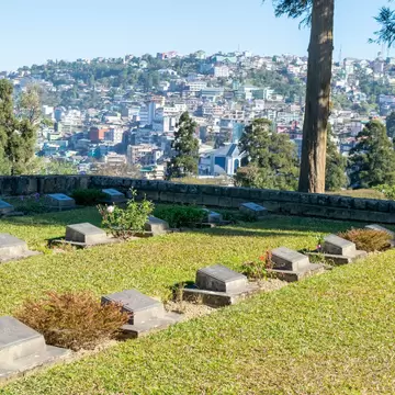 View of Kohima War Cemetery with city in the background. Nagaland, India.