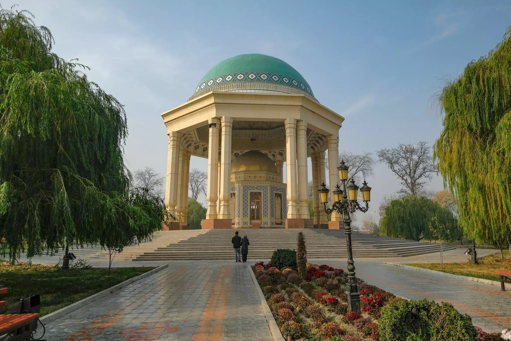 A couple walking through the Kamoli Khujandi Park in Khujand, Tajikistan.