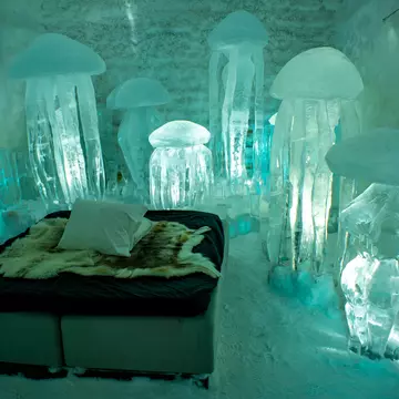 An ice room inside of an Icehotel.
