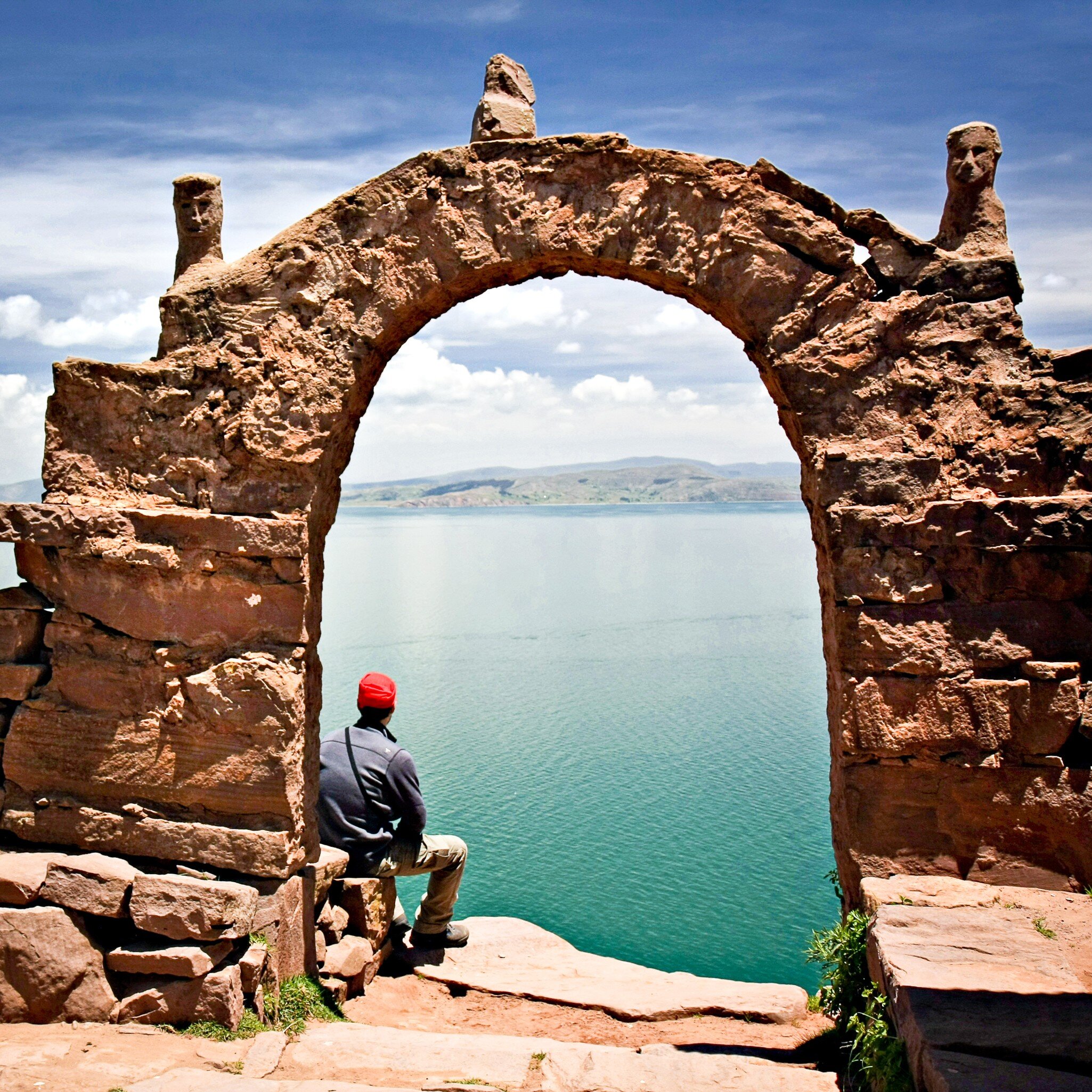 Man sits under a stone archway on Taquile Island.
111711794
top, sky, sea, peru, isla, arch, town, hike, gate, trek, lake, walk, blue, inca, path, puno, trail, latin, south, sunny, island, travel, scenic, outdoor, america, typical, culture, holiday, scenery, village, country, taquile, walkway, highland, amantani, titicaca, solitude, postcard, panorama, mountain, peruvian, tranquil, vacation, beautiful, landscape, destination, traditional, architecture
