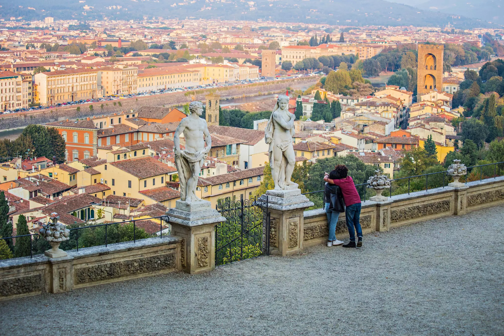 Romantic date at Bardini Garden in Florence. Couple observing Florence city from Bardini Garden viewpoint, Italy