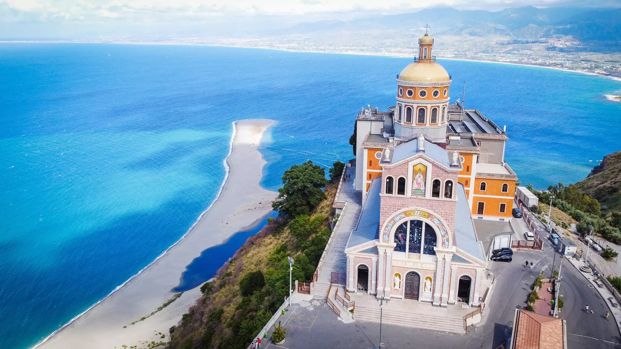 Santuario della Madonna Nera del Tindari, a majestic church near the blue waters of the sea