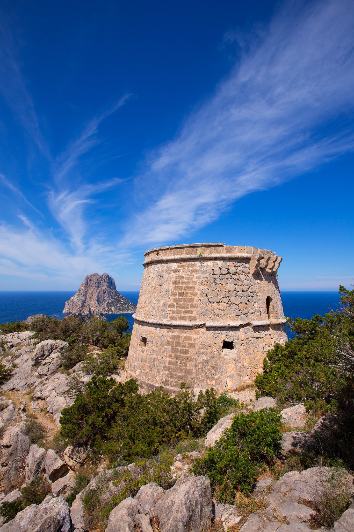 View of the Torre des Savinar, a watchtower on islets off the island of Ibiza, Spain.