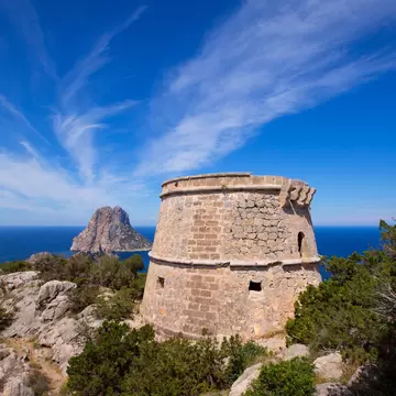View of the Torre des Savinar, a watchtower on islets off the island of Ibiza, Spain.