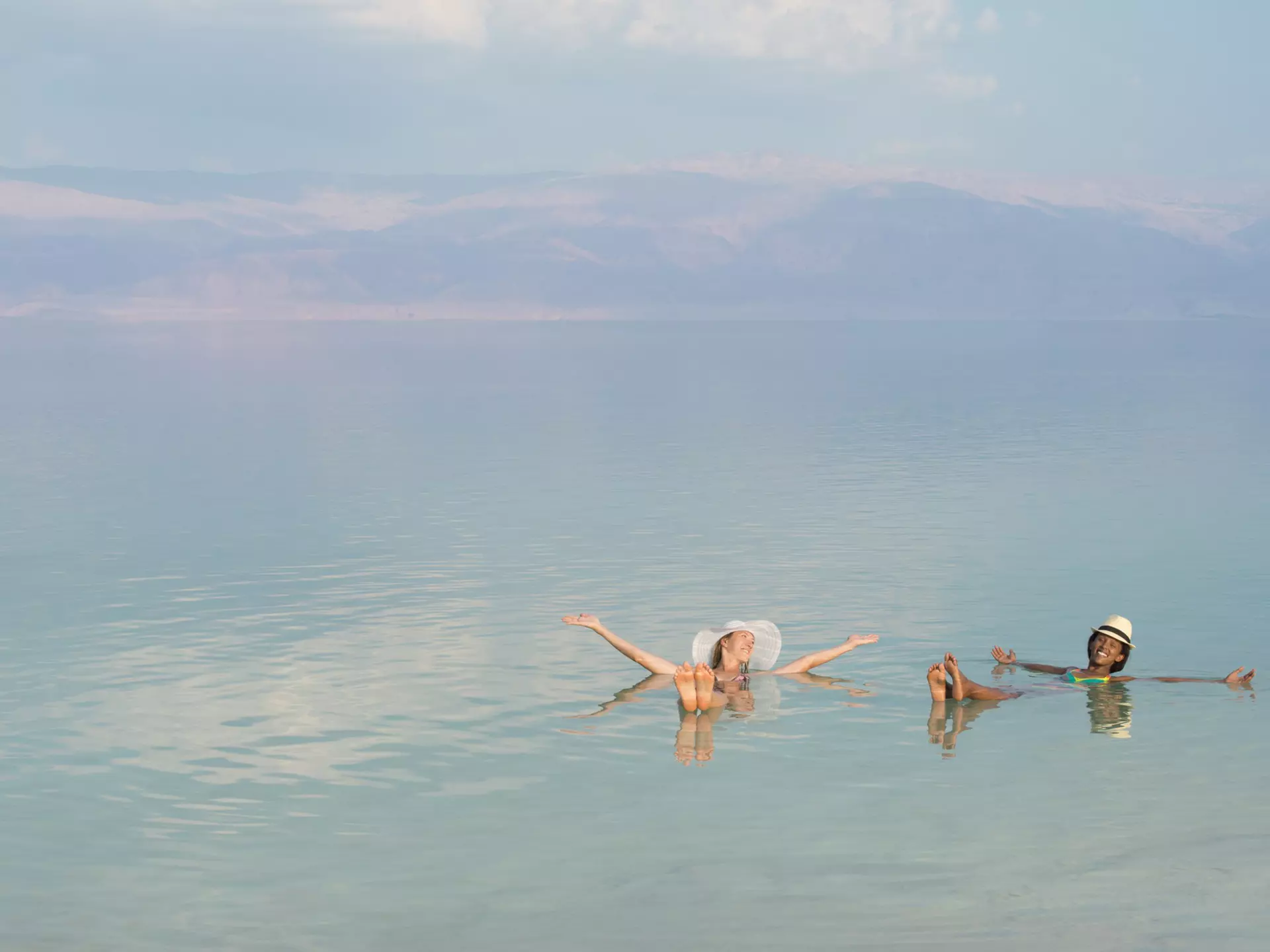 Lovely girls floating in salty water of Dead Sea and with Arms outstretched . Unusual buoyancy caused by high salinity.
525436087
African Descent, Arms Outstretched, Beach, Beauty In Nature, Bikini, Cheerful, Comfortable, Dead Sea, Enjoyment, Ethiopian Ethnicity, Female, Floating On Water, Freedom, Friendship, Gesturing, Getting Away From It All, Healthcare And Medicine, Healthy Lifestyle, Historical Palestine, Holding, Israel, Jordan, Journey, Joy, Lake, Lying On Back, Mineral, Mountain, Multi-Ethnic Group, Nature, Only Women, People, Recreational Pursuit, Relaxation, Salt, Sunbathing, Tan, Tourist, Tourist Resort, Tranquil Scene, Travel, Travel Destinations, Travel Locations, Two People, Vacations, Water, Women, Young Adult, Young Women, nowhere, salinity