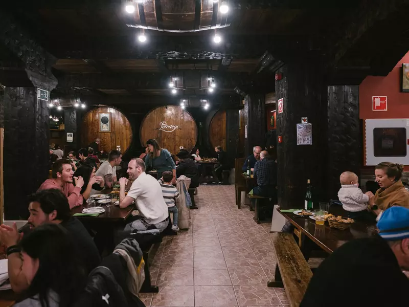 Try the famous Basque cider straight from the barrels at Petritegi Sagardotegia.