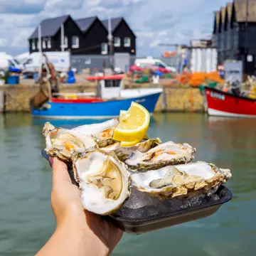 Time your visit for one of England's excellent foodie festivals, like the Whitstable Oyster Festival in Kent © cktravels.com / Shutterstock