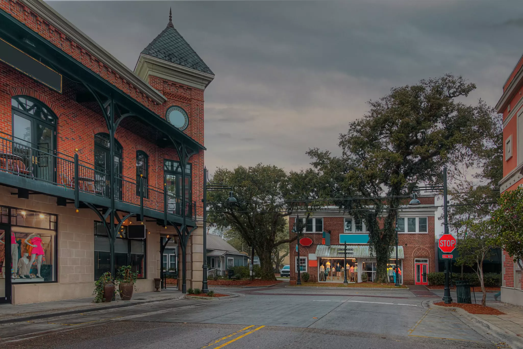 A street in a town with historic buildings is seen early in the morning.