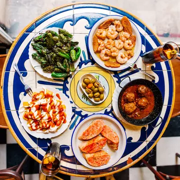 Various tapas served in a tapas bar, directly above view