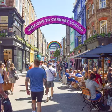 A busy Carnaby Street in Central London on a hot sunny summer's day.  