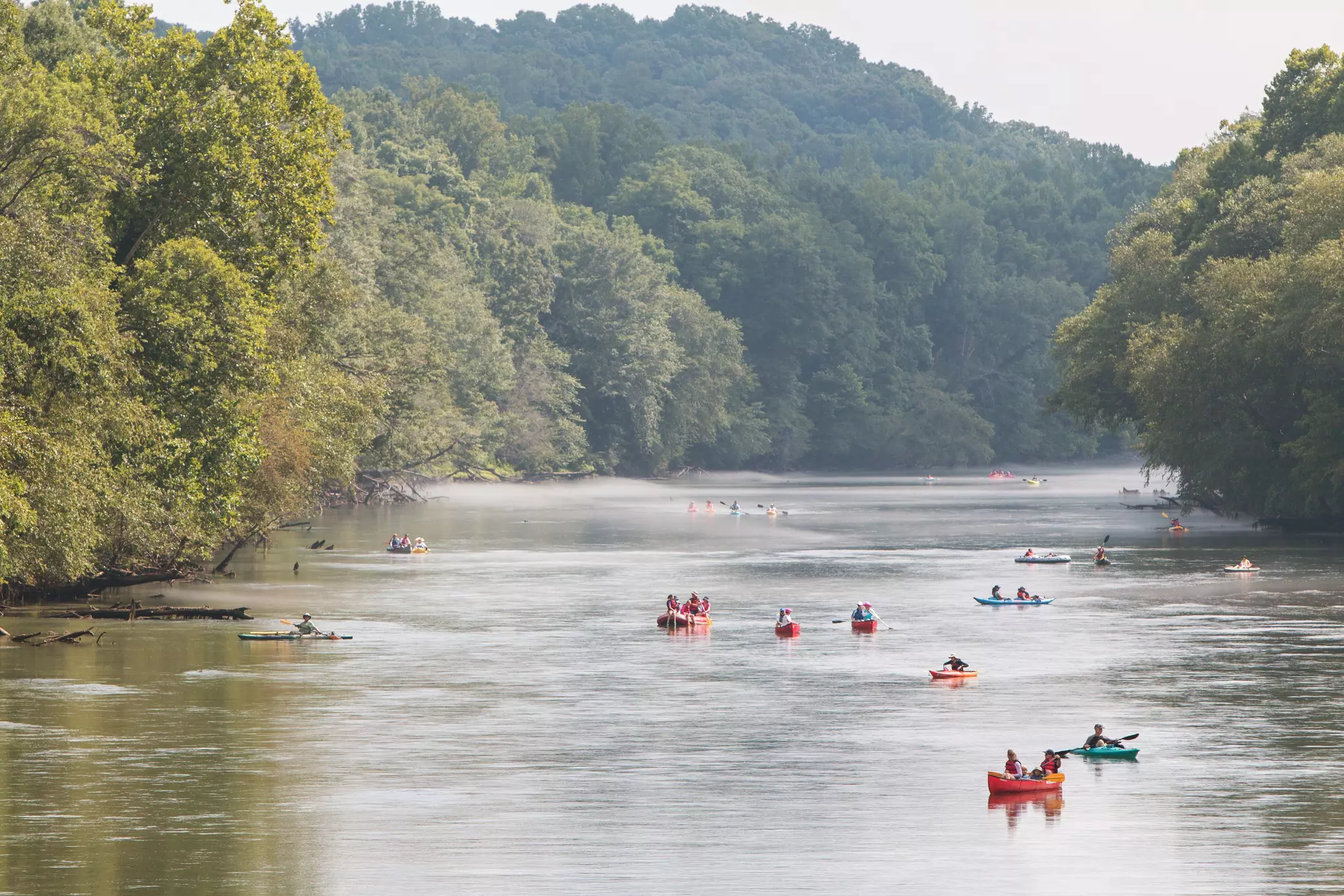 People raft, kayak and canoe down the Chattahoochee River on a hot summer day in Atlanta, Georgia, USA.