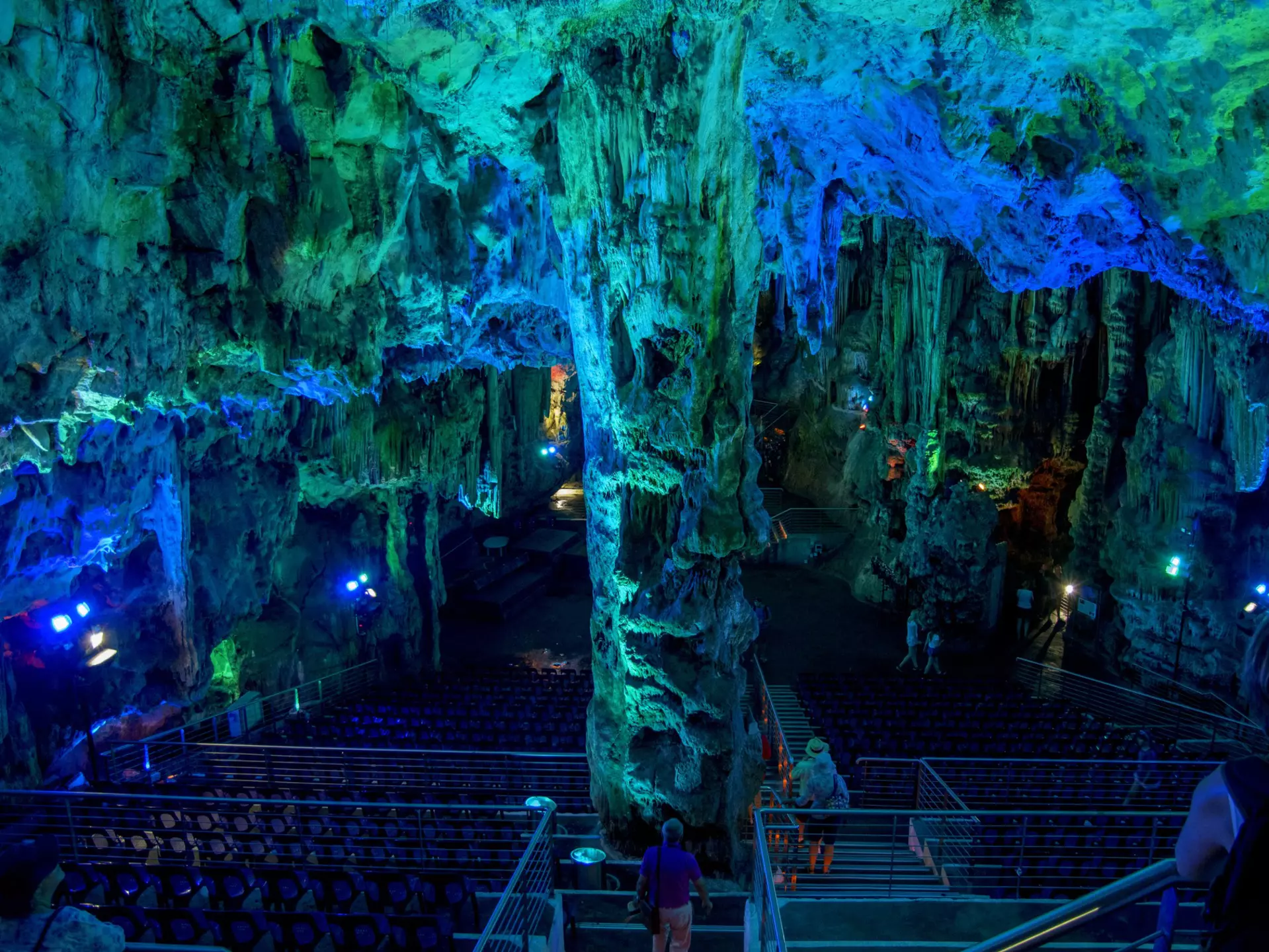 A cave enhanced with light that makes its ceilings blue and green