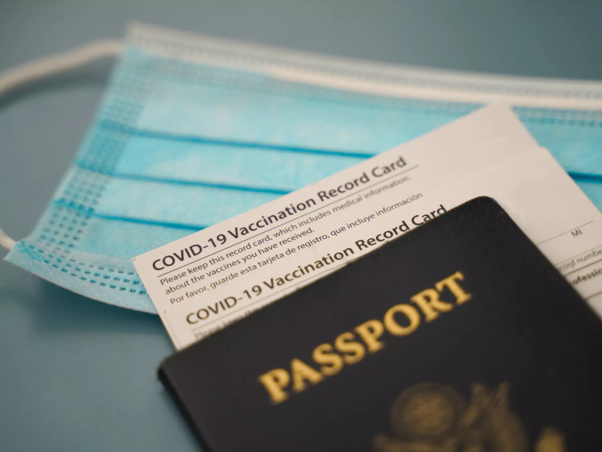 A passport and COVID-19 vaccine card.