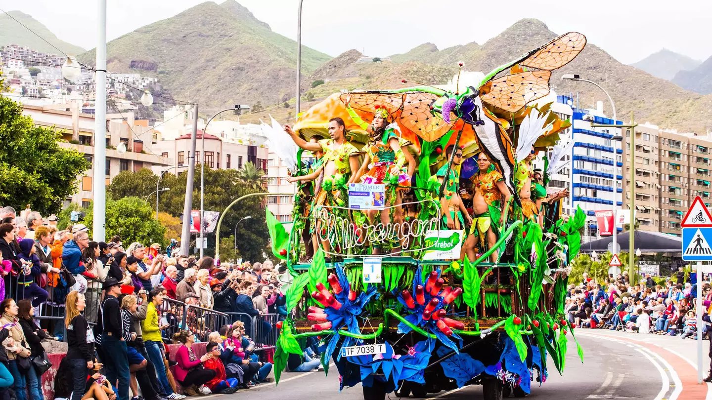 Carnival groups and costumed characters parade through the streets in Tenerife