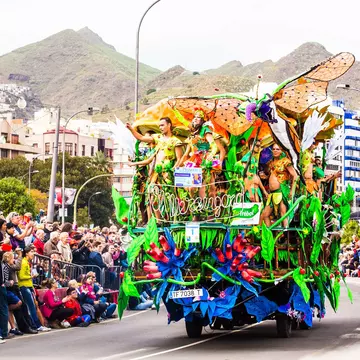 Carnival groups and costumed characters parade through the streets in Tenerife