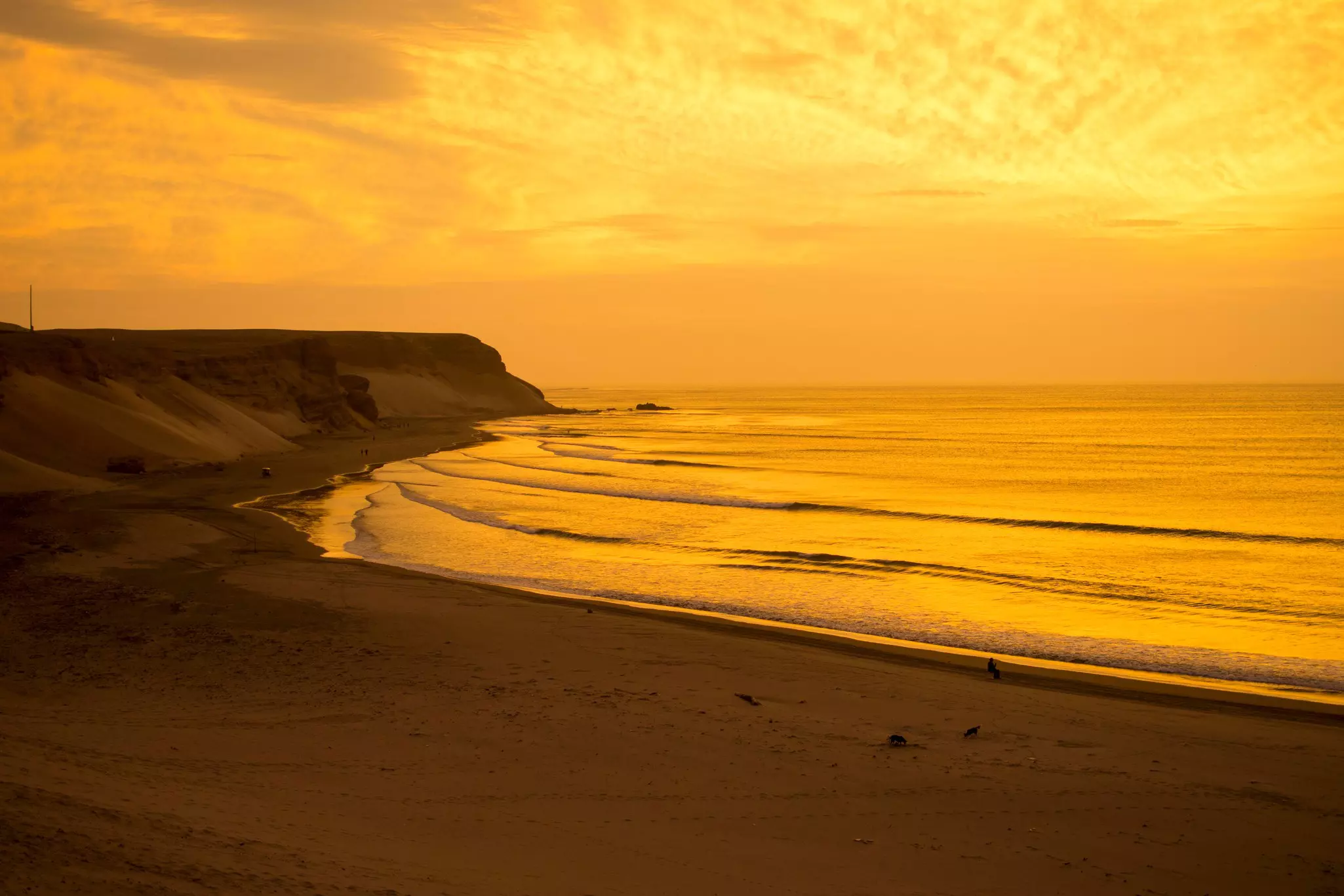Sunset at Chicama beach, in Puerto Malabrigo, Peru.