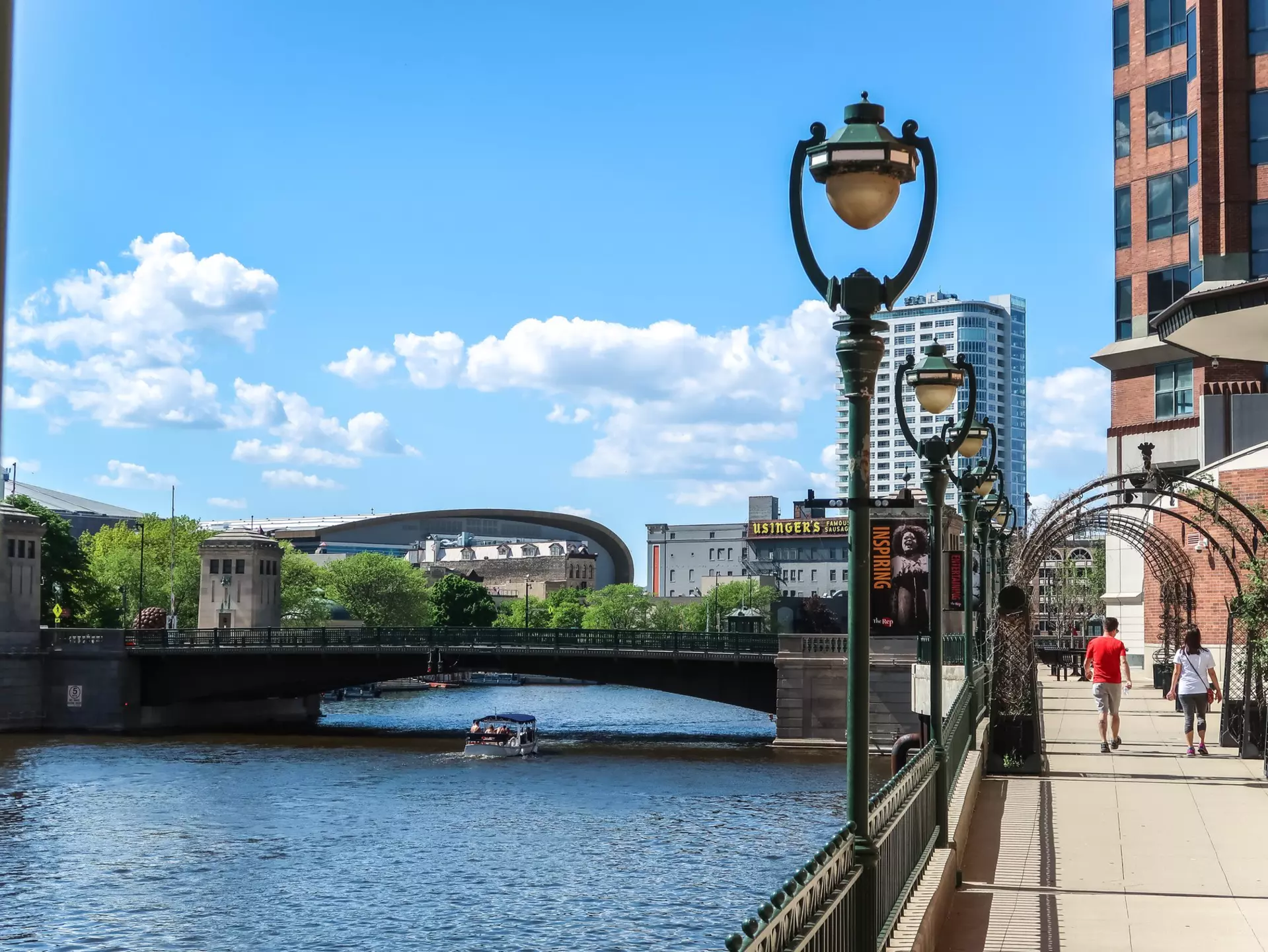 Milwaukee, Wisconsin - May 26th, 2018: The new Milwaukee Bucks Fiserv Forum multi-purpose basketball arena's curved roof rises above nearby buildings adjacent to the Milwaukee River in downtown., License Type: media, Download Time: 2025-08-22T14:41:20.000Z, User: mvm_lonelyplanet, Editorial: true, purchase_order: 56530 - Guidebooks, job: Eastern USA 7, client: Global Publishing-WIP, other: Virginia Moreno