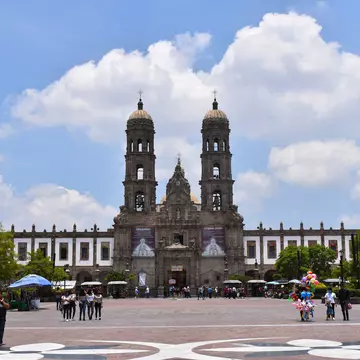 Zapopan, Mexico - July 5 2020: Wide front view of the Zapopan basilica, with some clouds in the sky