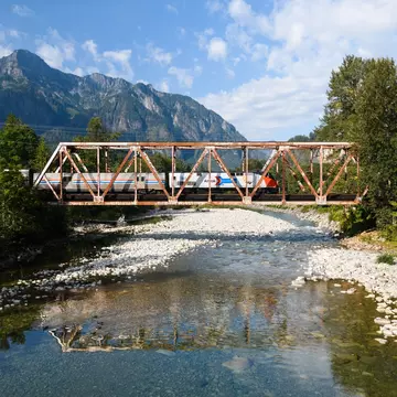 The Empire Builder train crossing the North Fork Skykomish River, Washington. Ian Dewar Photography/Shutterstock