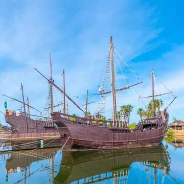 View of the replicas of Columbus' ships, Niña, Pinta and Santa María in the water at Muelle de las Carabelas in Spain.